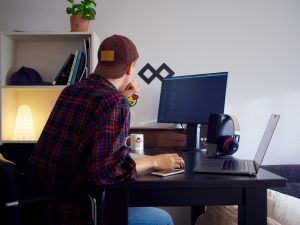 Freelancer with Computer and Laptop